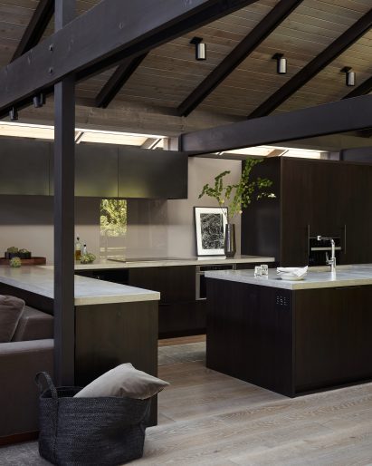 The kitchen has light grey countertops