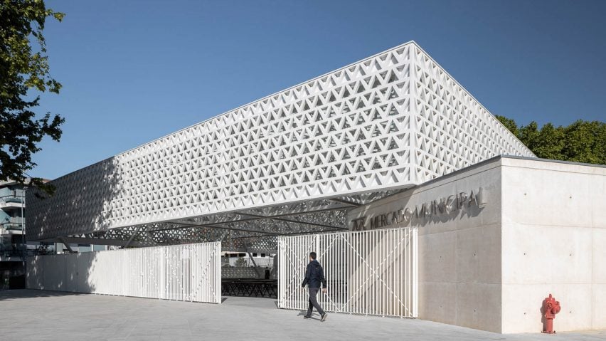 Triangular-patterned canopy shelters stalls at modernised Portuguese marketplace