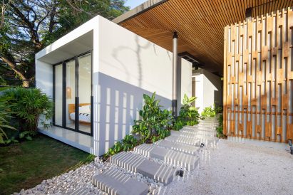Concrete bedroom pod with walkway in house by Studio Saxe