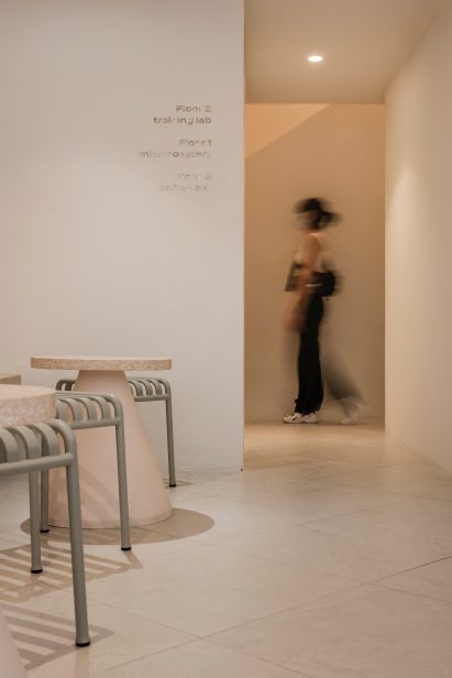 Woman walking through Paga cafe