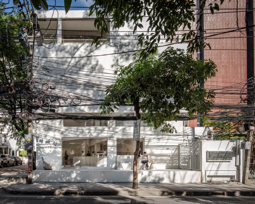 A white coffee shop with three floors