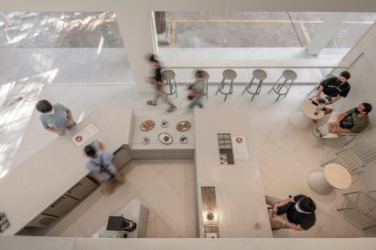 People sitting in a white cafe
