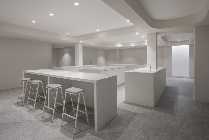 White stools and tables in the workshop room