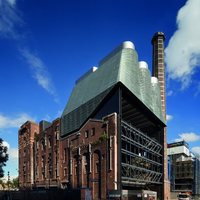 The power plant is clad in green zinc mesh