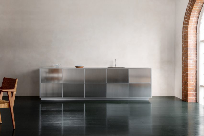 A photograph of a kitchen that reflects light