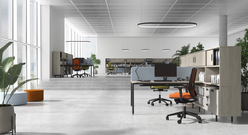 Office with desks arranged in twos and separated by a central privacy screen