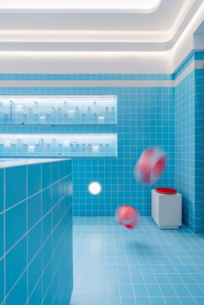 beach balls bouncing inside a blue store