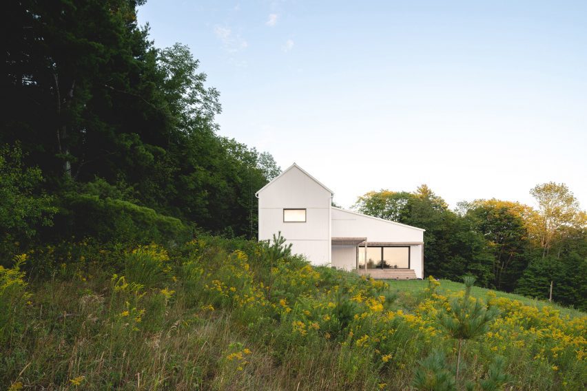 House nestled into sloping site