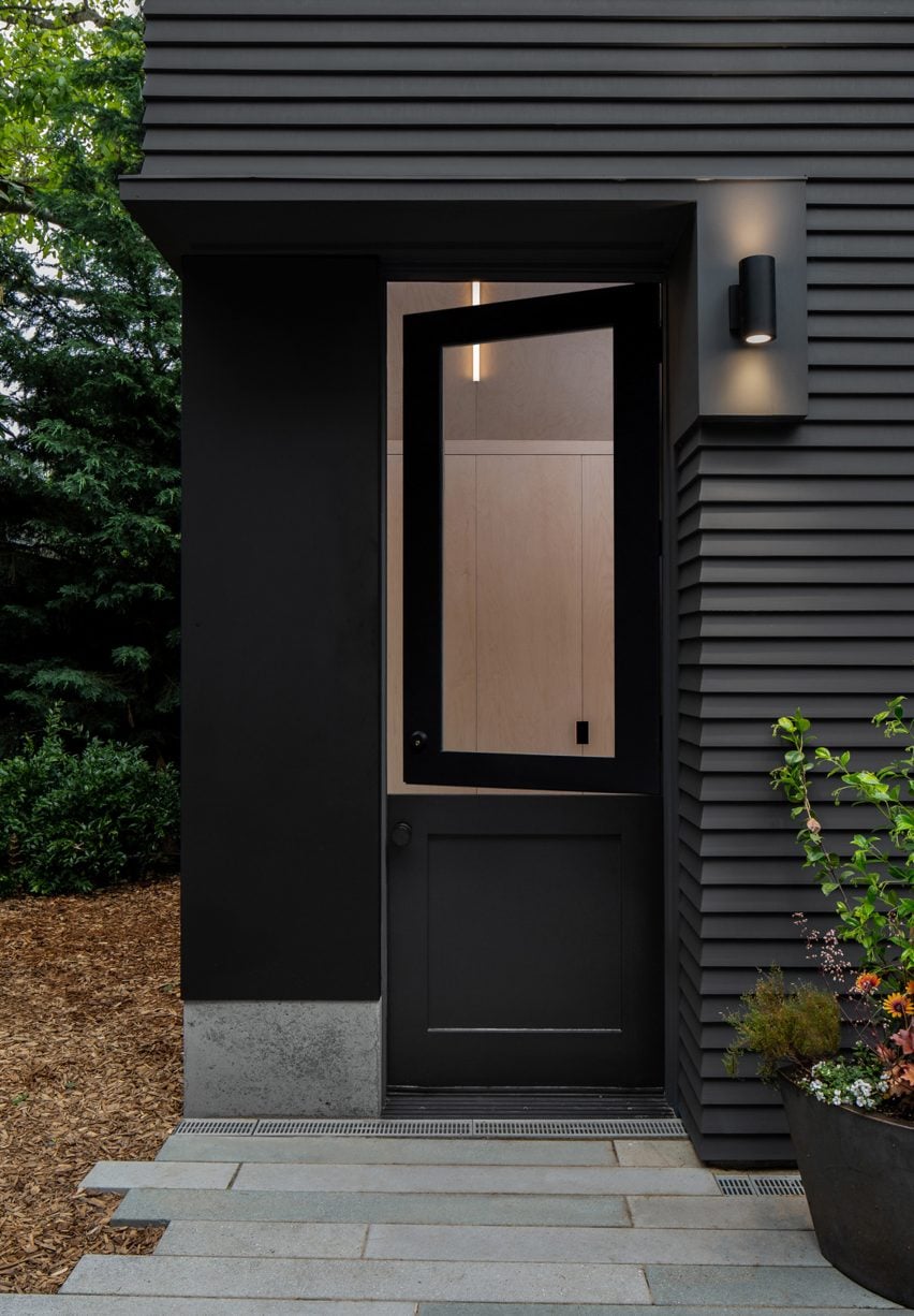 A black door at the entrance of the gym and office space