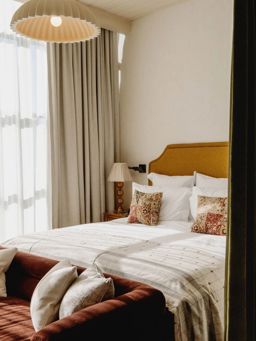 Bed beside a window