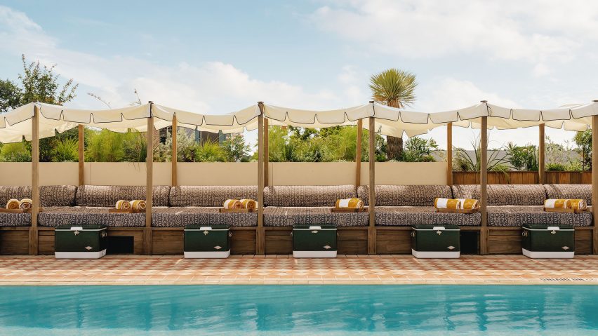 Loungers alongside swimming pool