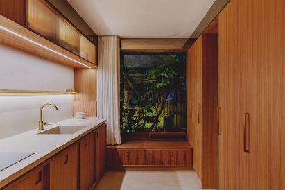 The kitchen feels like a self-contained unit crafted entirely from elm