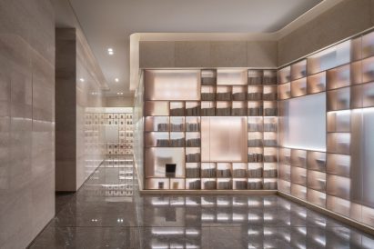 Books arranged on large wooden bookshelves in The Glade Bookstore