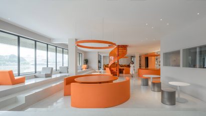 Circular orange seating booths in cafe of Duoyin bookstore