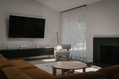 The living room has a velvet sofa