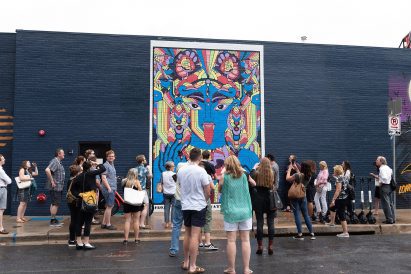 Visitors explore the city through tours