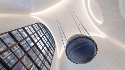 An art piece is hung from the ceiling