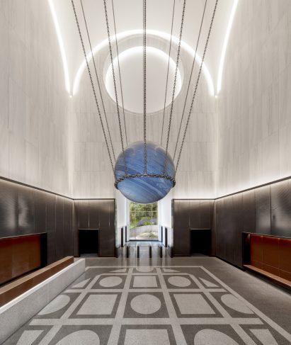 A sculpture by Alicja Kwade is hung in the centre of the lobby of 550 Madison