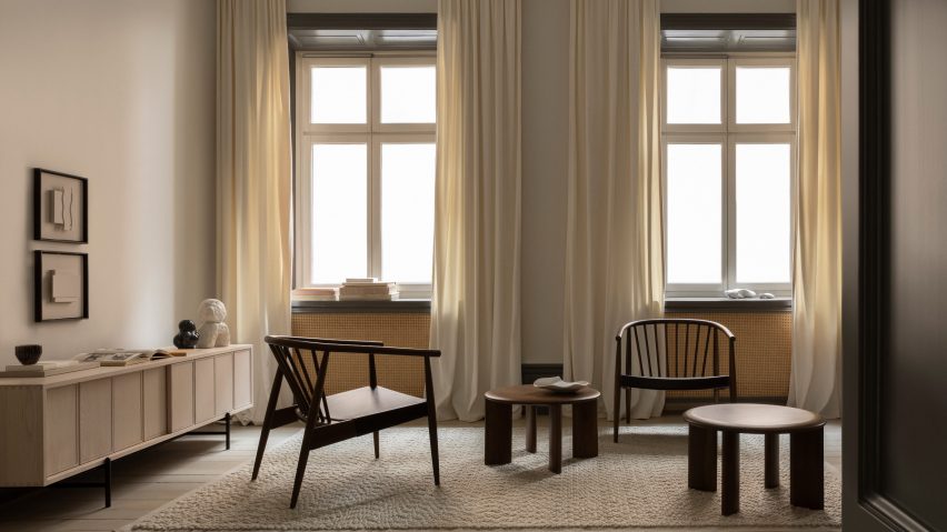 Living room with wooden lounge chairs by L.Ercolani