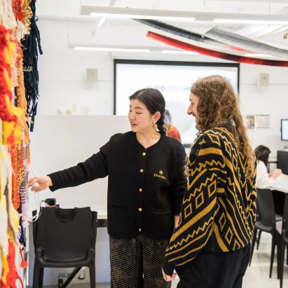 Parson's Design students looking at a textile exhibition