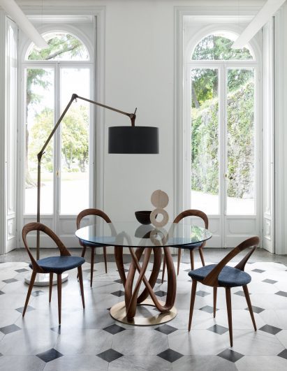 A photograph of a wooden and glass table