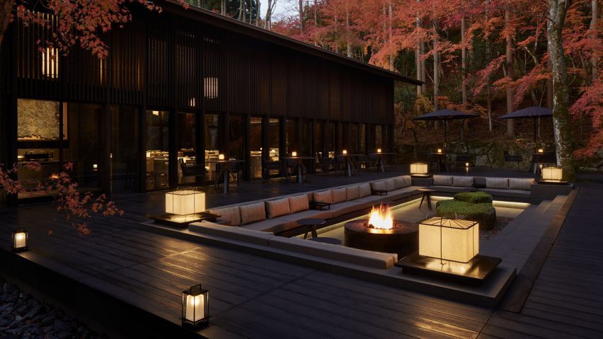 A photograph of a hotel in a forest
