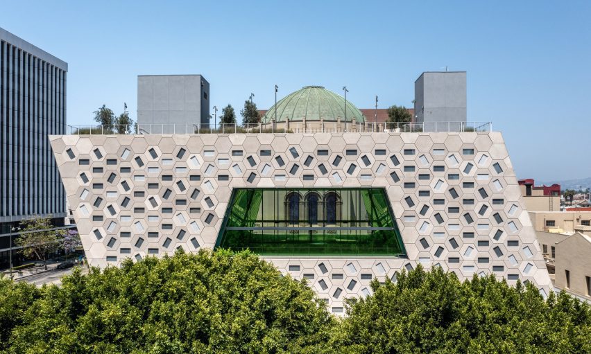 Hexagonal tiles covering the building's facades