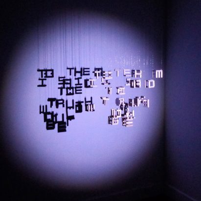 Multiple strings of letters arranged into words with different words displaying in the shadows