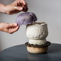 Coloured bowls balancing on top of each other