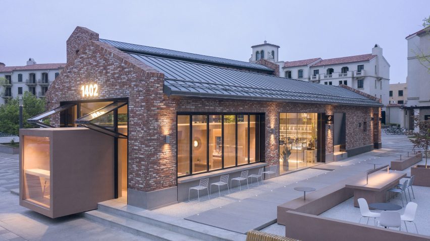 BLUE Architecture adds rectangular coffee shop to red brick building in Aranya
