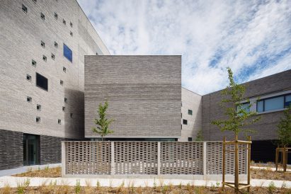 View of the exterior of Contemporary International Resource Library from the garden