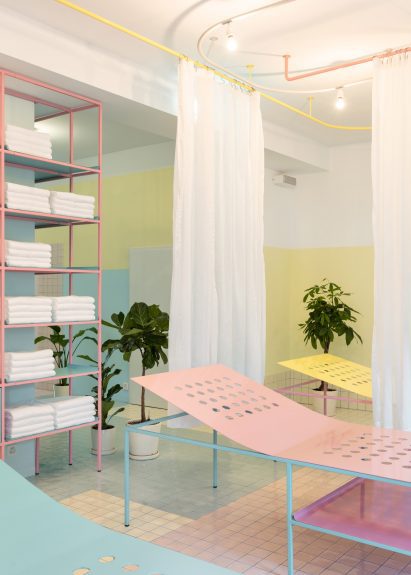 Pastel coloured lounges and tiled floors in Origin Spa