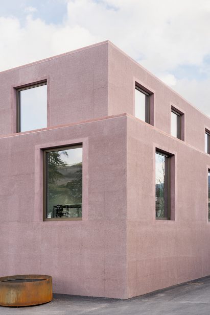 Dusty pink concrete volumes at the school building