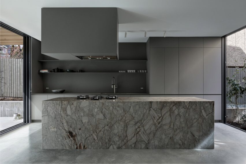 A grey kitchen inside Courtyard House
