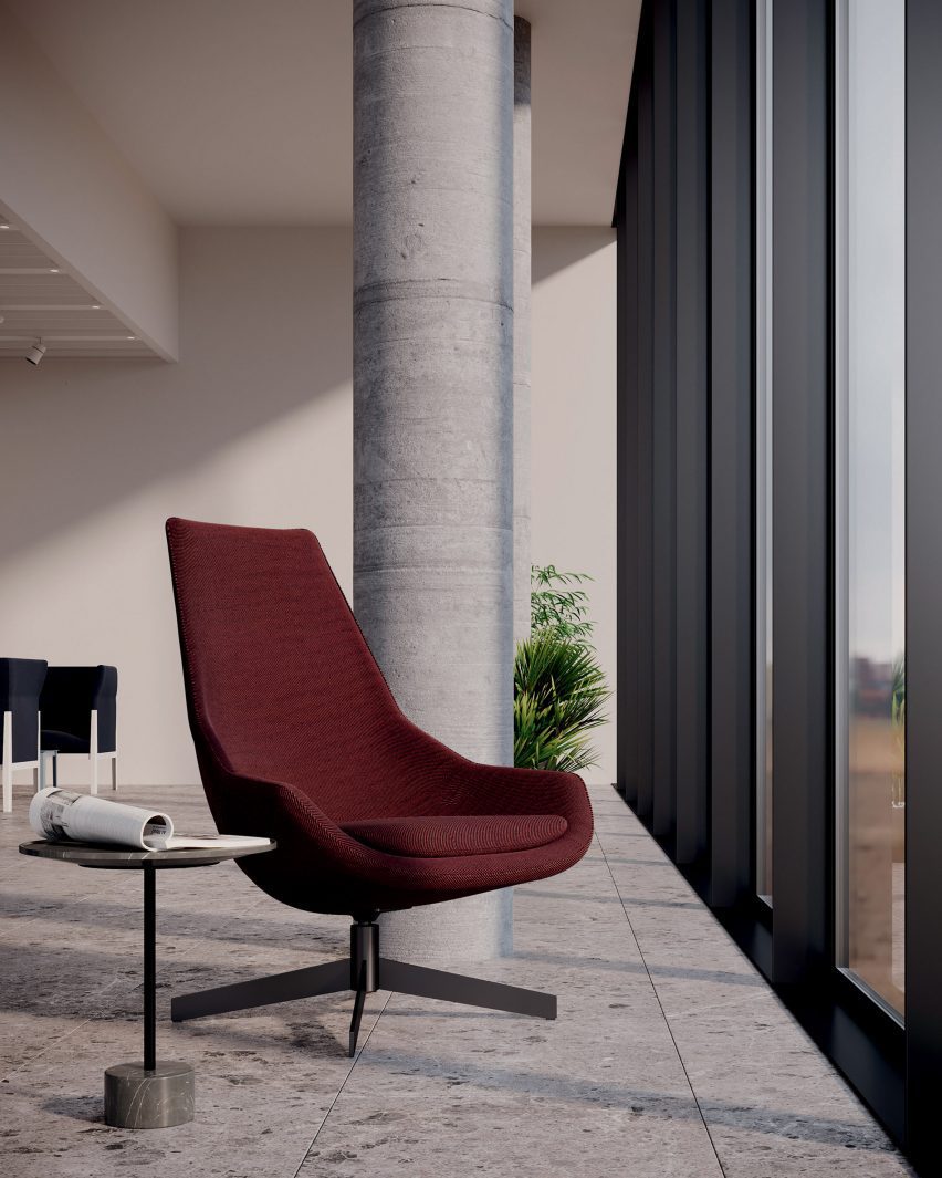 A photograph of a red chair a work space