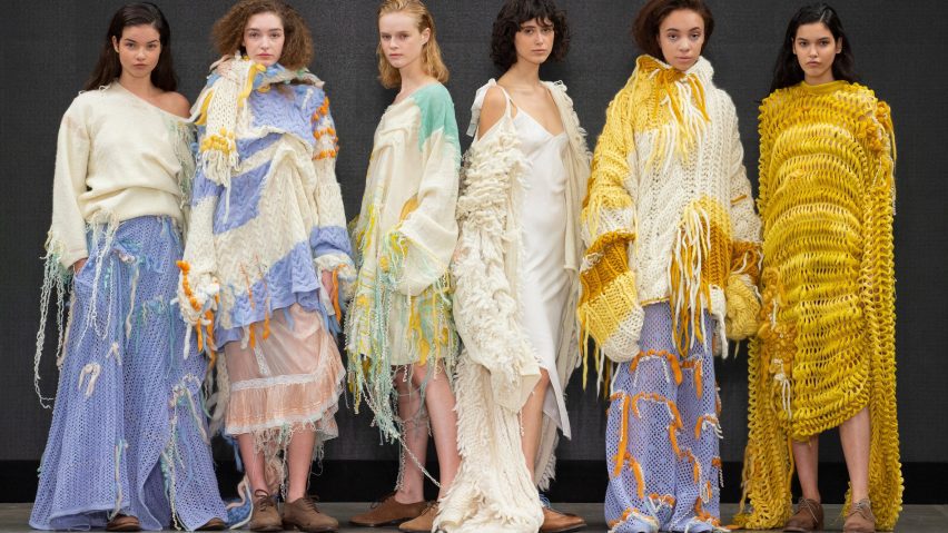 Six models lined up dressed in pastel coloured knitwear