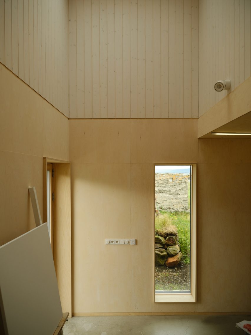 A wood-lined artist studio