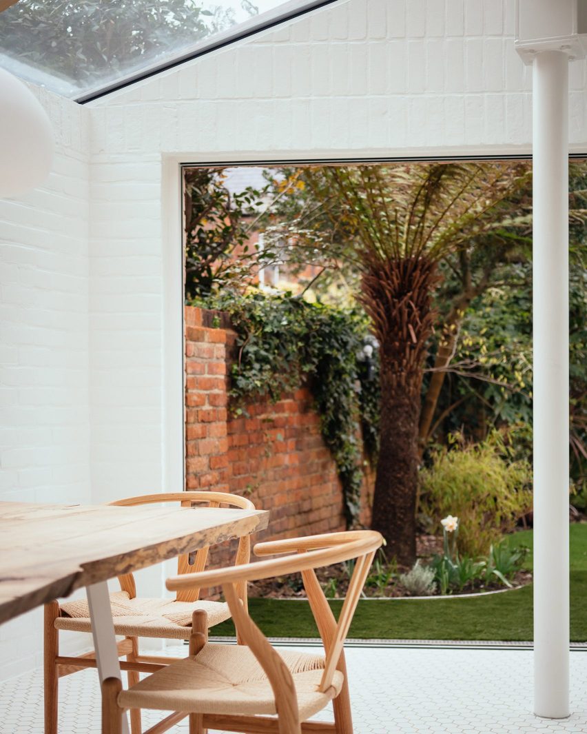 White kitchen with wooden dining table