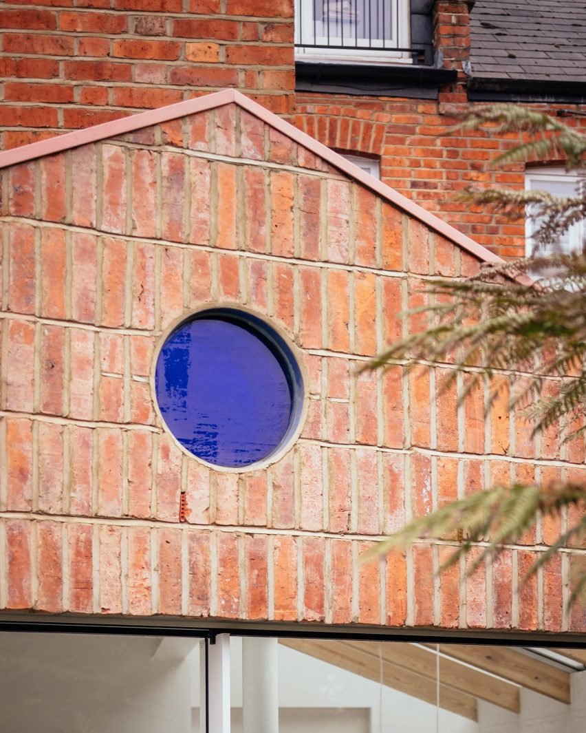 Brick facade with a blue window