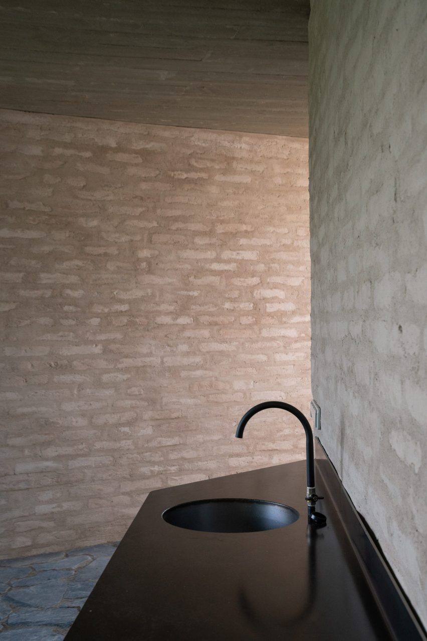 A brick-walled bathroom