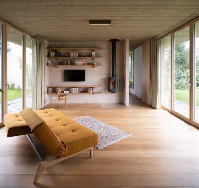 A living room with brick walls