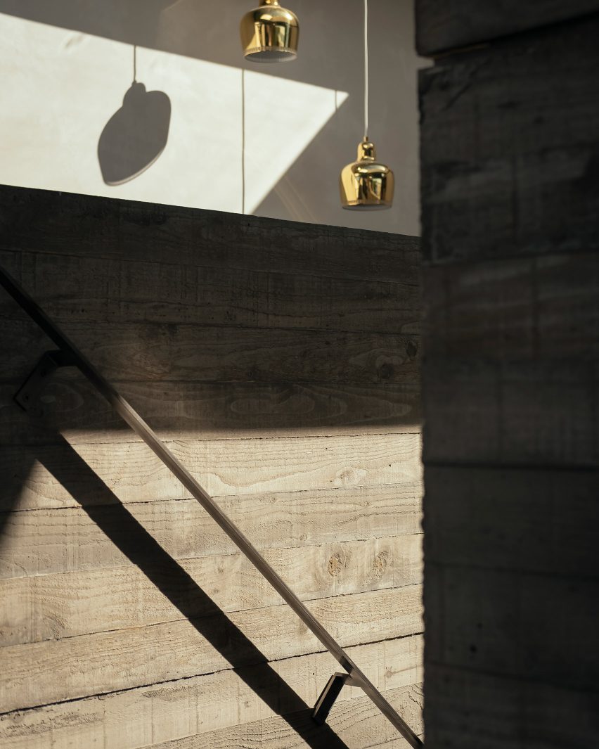 Concrete interiors of House with Courtyards