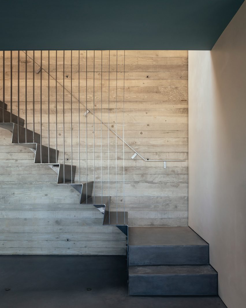 Concrete stairwell in House with Courtyards