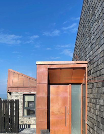 A copper and slate-clad house
