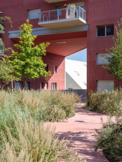 A facade covered in red stucco