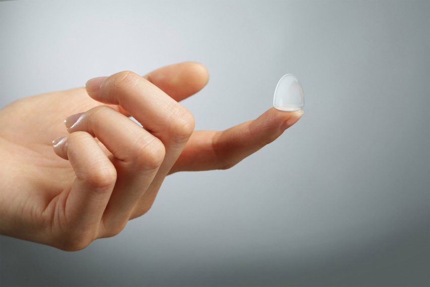 A hand holding a contraceptive