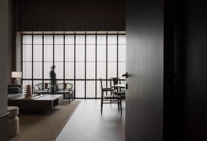 Interior by JG Phoenix with translucent screens and wooden furniture