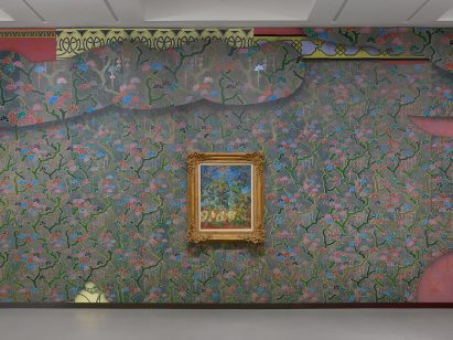 A Vincent van Gogh painting hanging on a colourful wall