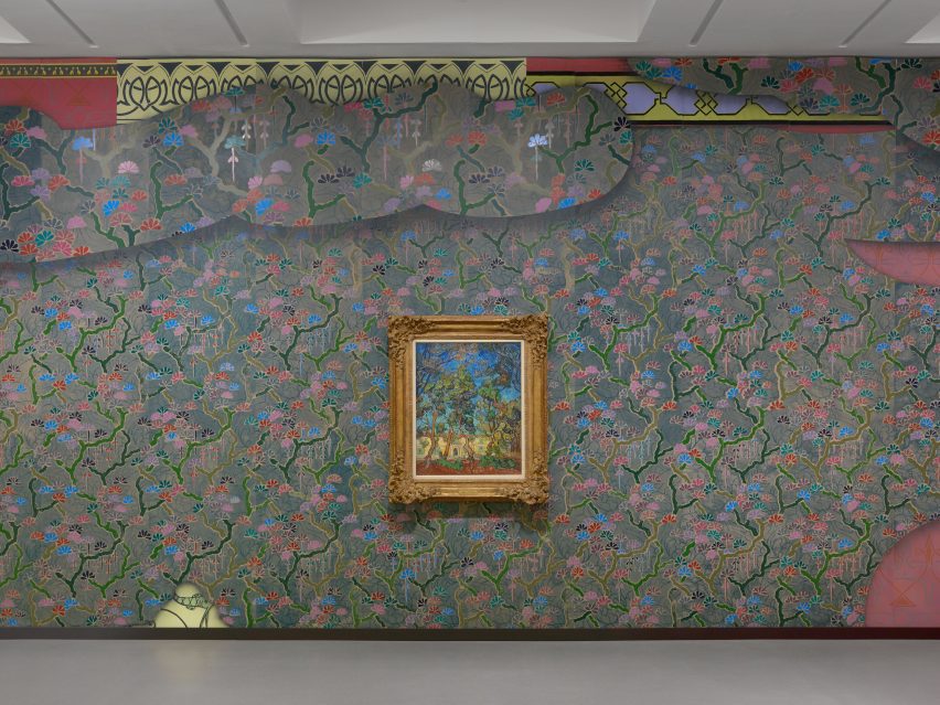 A Vincent van Gogh painting hanging on a colourful wall