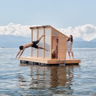 People diving off the deck of the sauna
